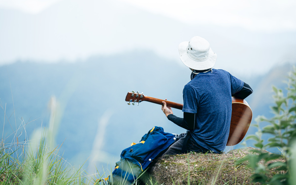 man playing guitar - emotional health advice to do what you like by dr stephen simpson